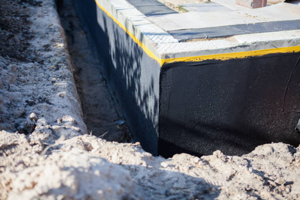 Professional Waterproofing technician working in South Milford, IN